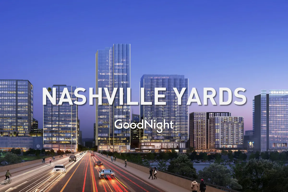 A bustling urban scene featuring modern skyscrapers, the dynamic Nashville city skyline, and traffic bustling below. The image exudes energy, capturing the excitement of an urban lifestyle filled with dining, shopping, and cultural experiences.